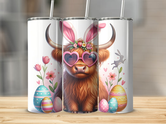 Highland cow with bunny ears and heart sunglasses, surrounded by Easter eggs and flowers.