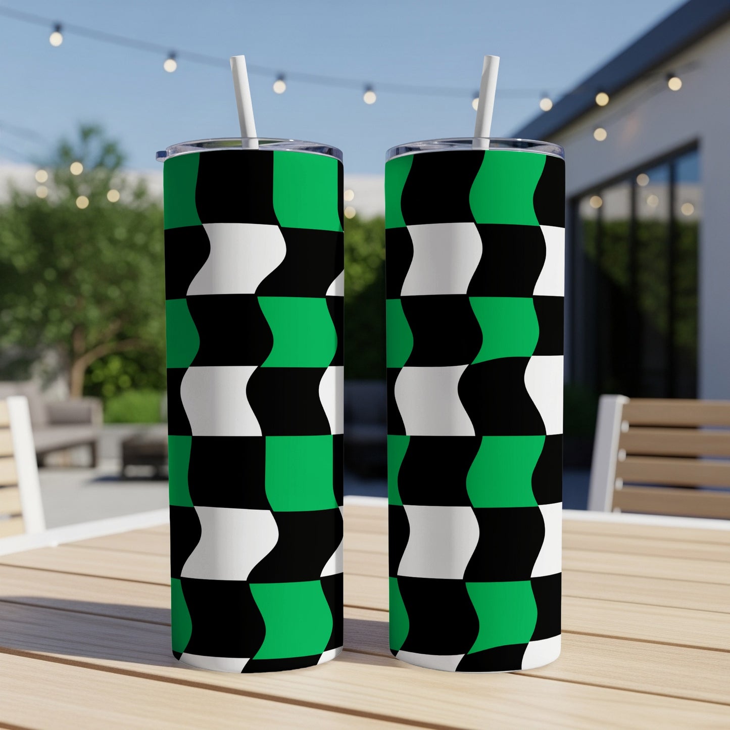 Two tall tumblers with a green, white, and black checkered pattern.