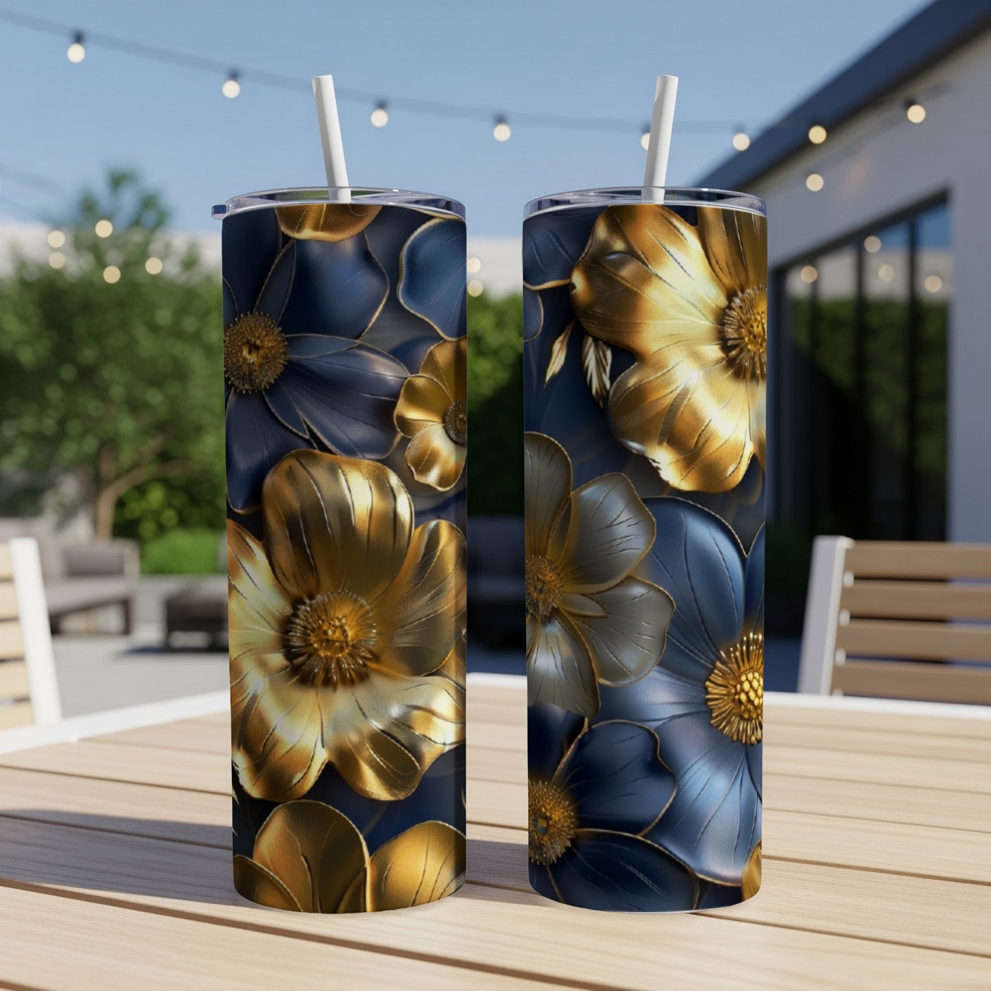 Two tall tumblers with a dark blue and gold floral design.