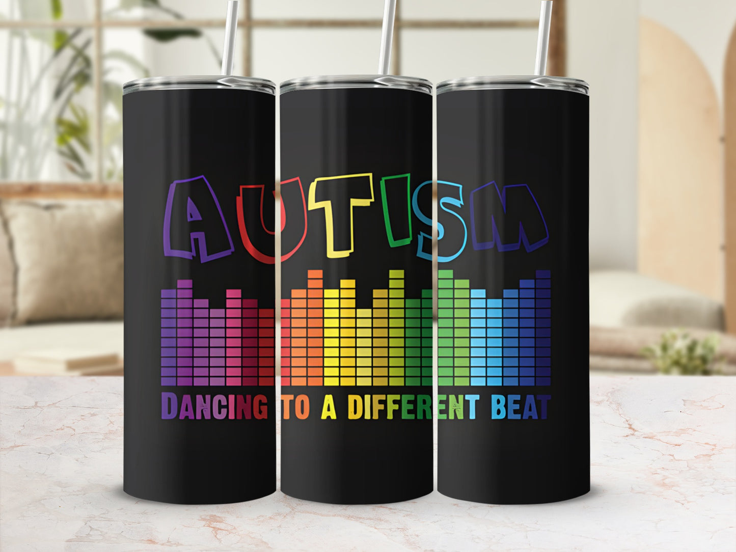 Black tumbler with "Autism Dancing to a Different Beat" in colorful equalizer design.