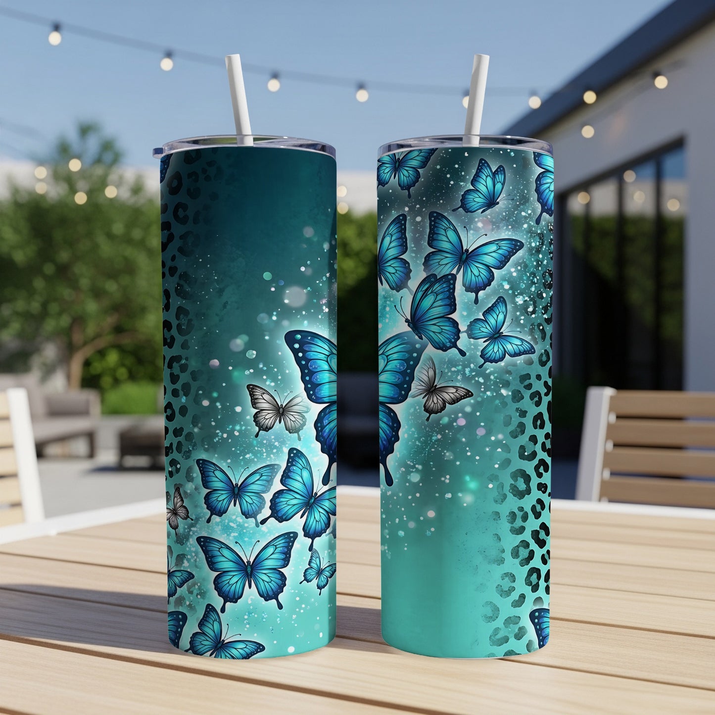Two teal tumblers with blue butterflies and leopard print design.