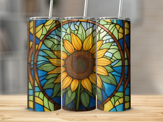 Three tumblers with stained glass sunflower design on a wooden surface.