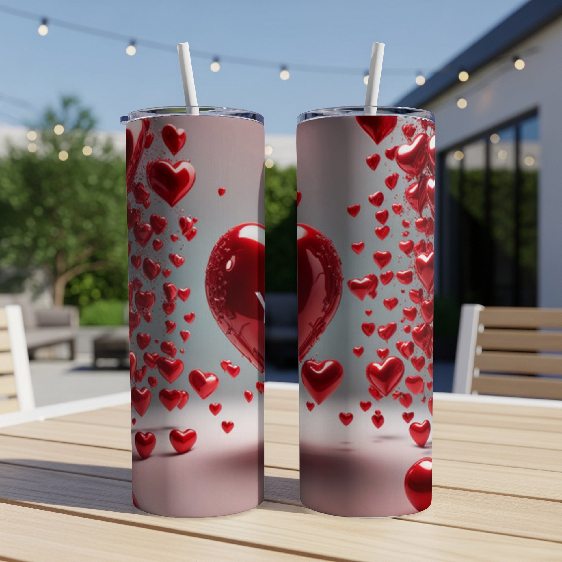 Two tumblers with a pattern of red heart balloons.
