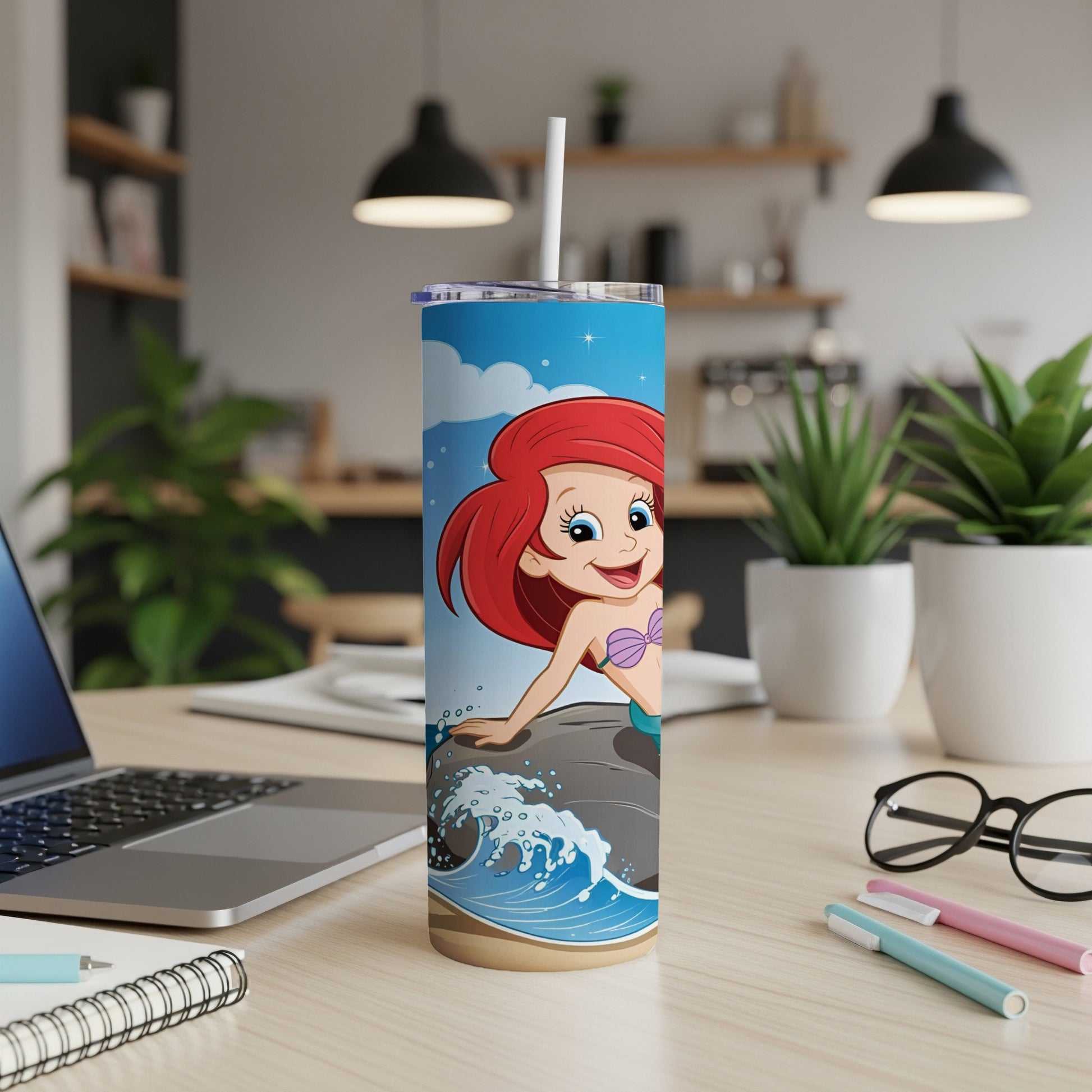 Ariel the Little Mermaid on a rock with ocean waves, on a stainless steel tumbler.