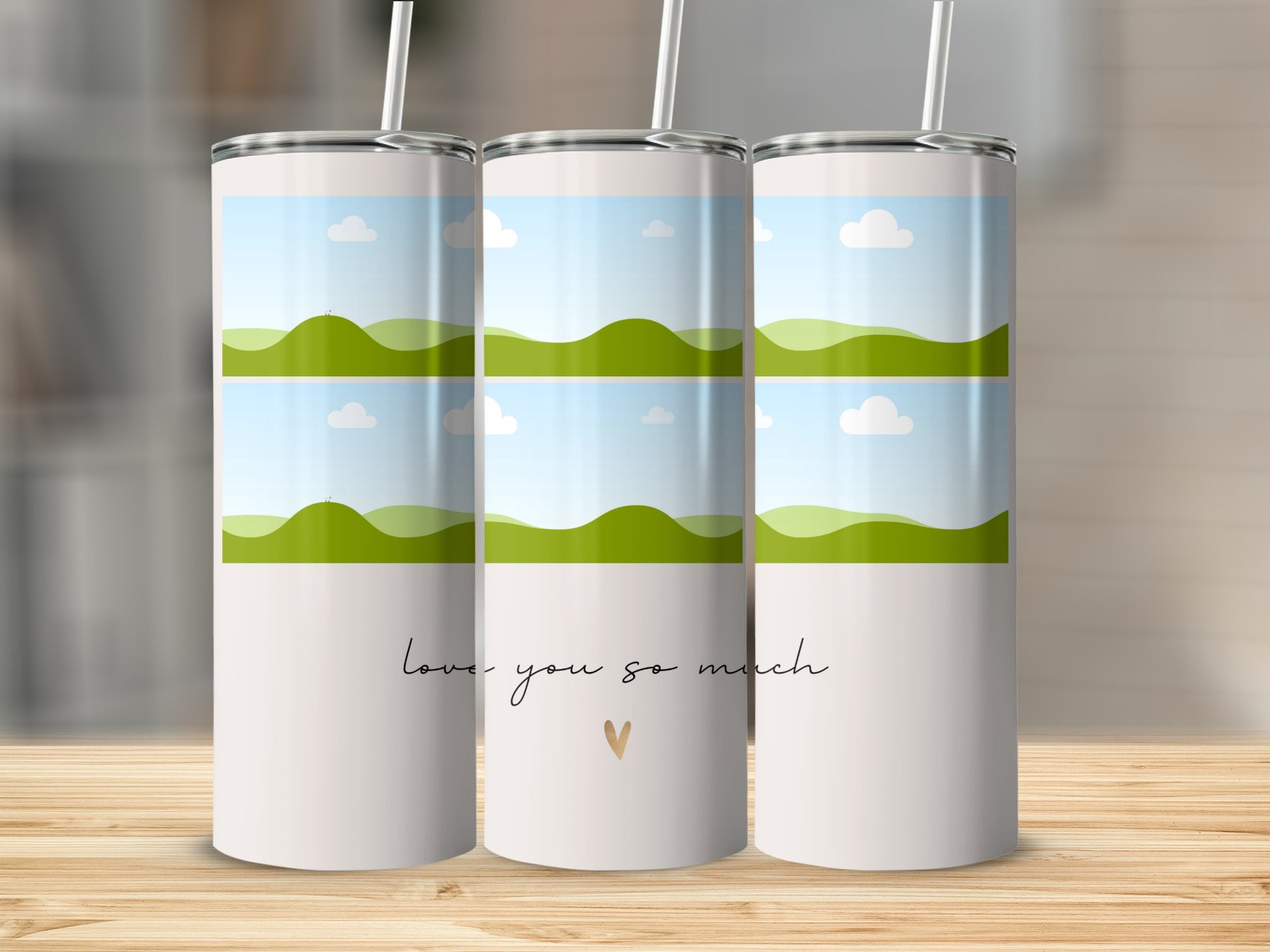 White tumblers with landscape art and "love you so much" text.