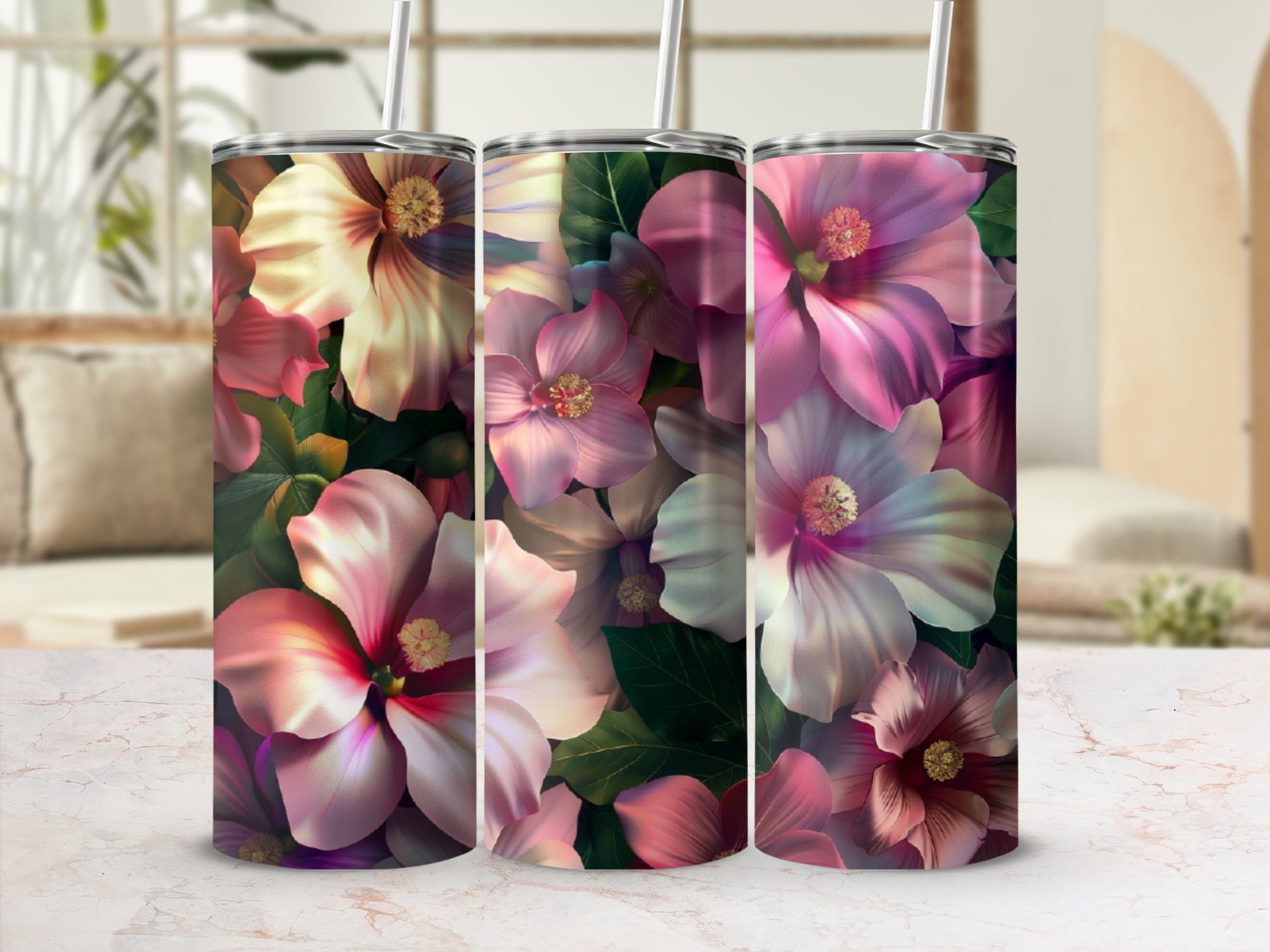 Three tumblers with a vibrant floral pattern featuring pink and purple hibiscus flowers.