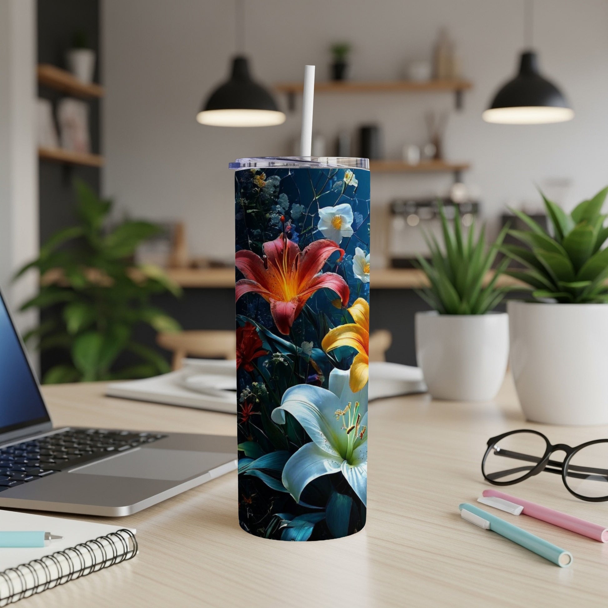 Tumbler with vibrant floral illustration of lilies and other flowers.