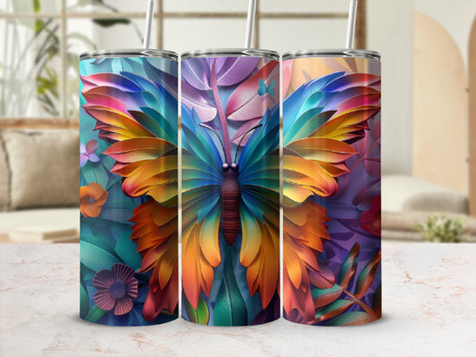 Three tumblers decorated with colorful butterfly and floral designs.