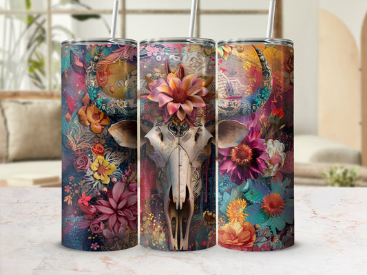 Floral skull tumbler with colorful floral designs and a straw.