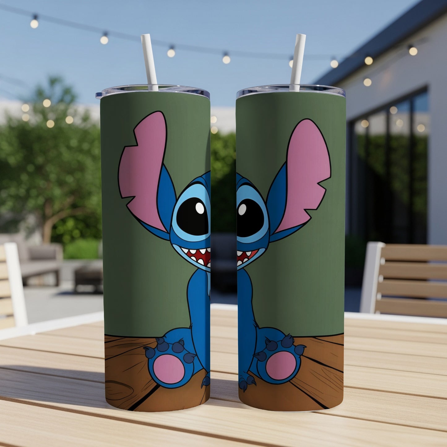 Two tumblers featuring a cartoon Stitch character sitting on a wooden surface.
