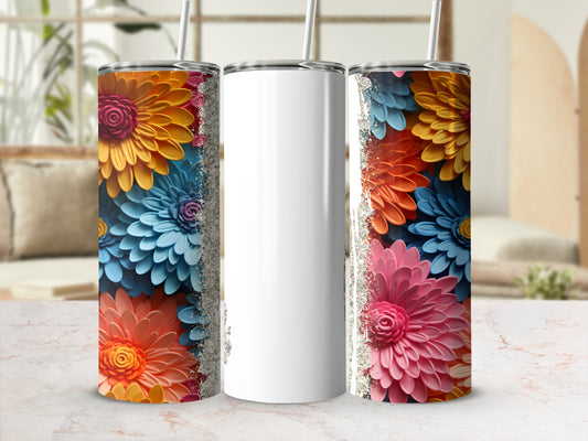 Three tumblers with colorful floral patterns, one blank.