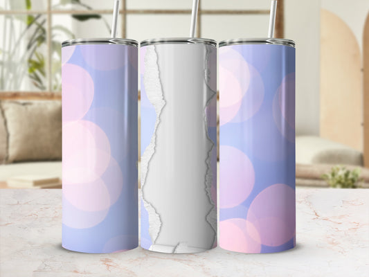 Three tumblers with a bokeh background, one showing the design.