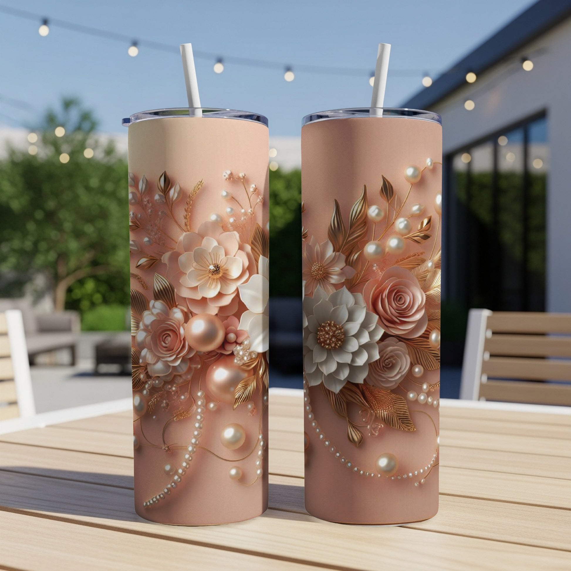 Two tall tumblers with rose gold floral and pearl embellishments.