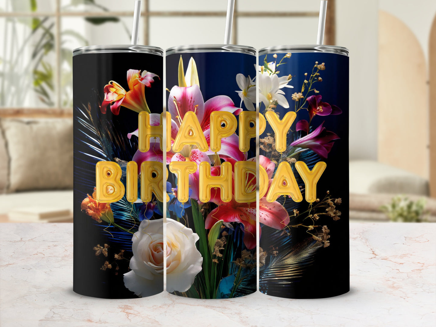 Tumbler with "Happy Birthday" text and floral design against a blurred background.