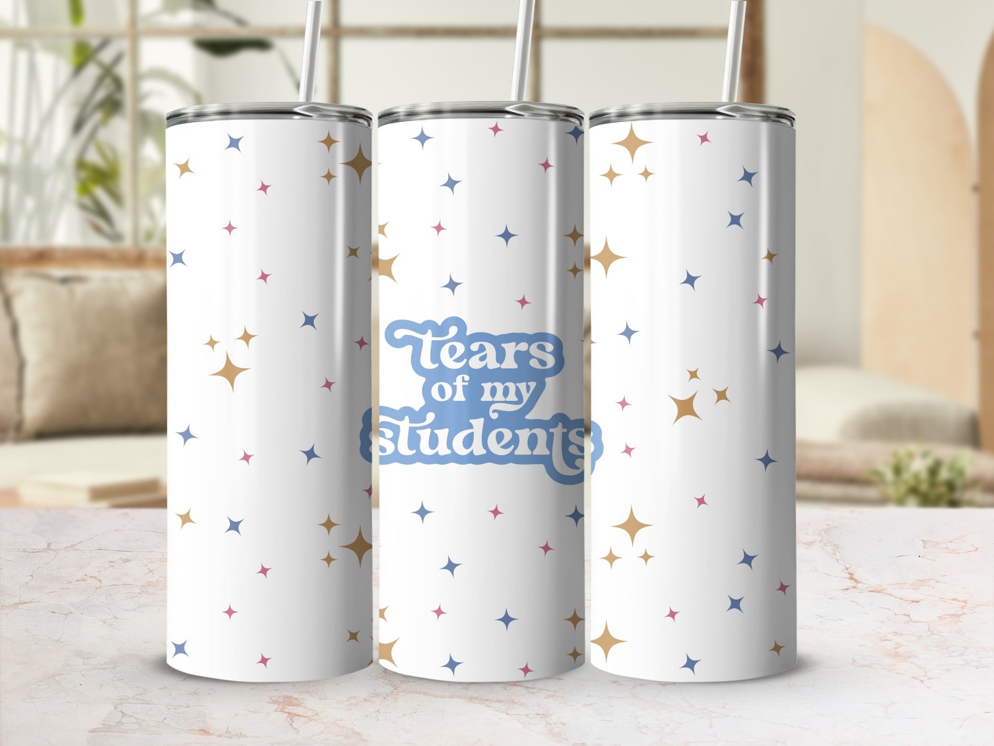 White tumbler with blue text "Tears of my Students" and scattered stars.