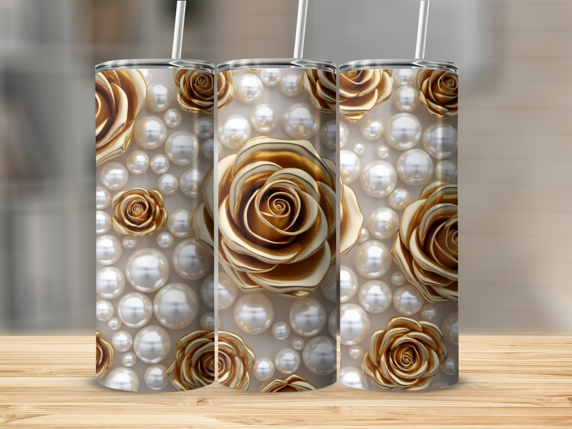 Gold roses and pearls design on three white tumblers with straws.