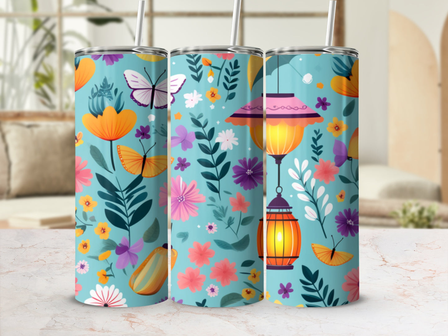 Three teal tumblers with floral and butterfly designs and hanging lanterns.