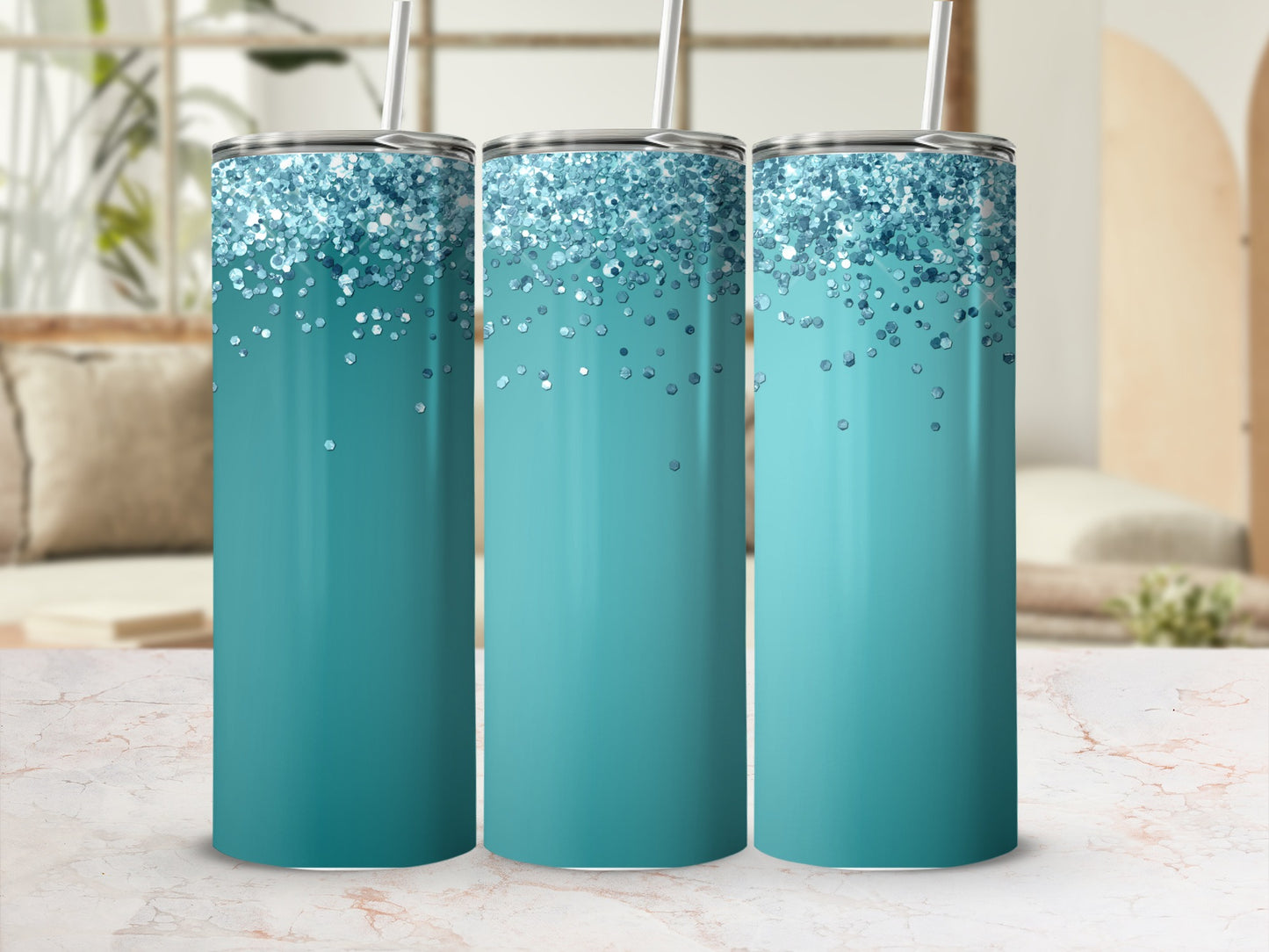 Three teal tumblers with blue glitter patterns at the top.