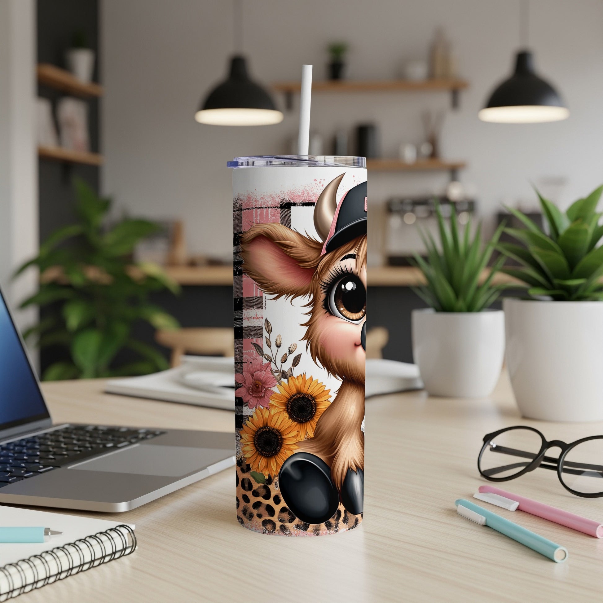 Cute cow with sunflowers on a tumbler with a checkered pattern.