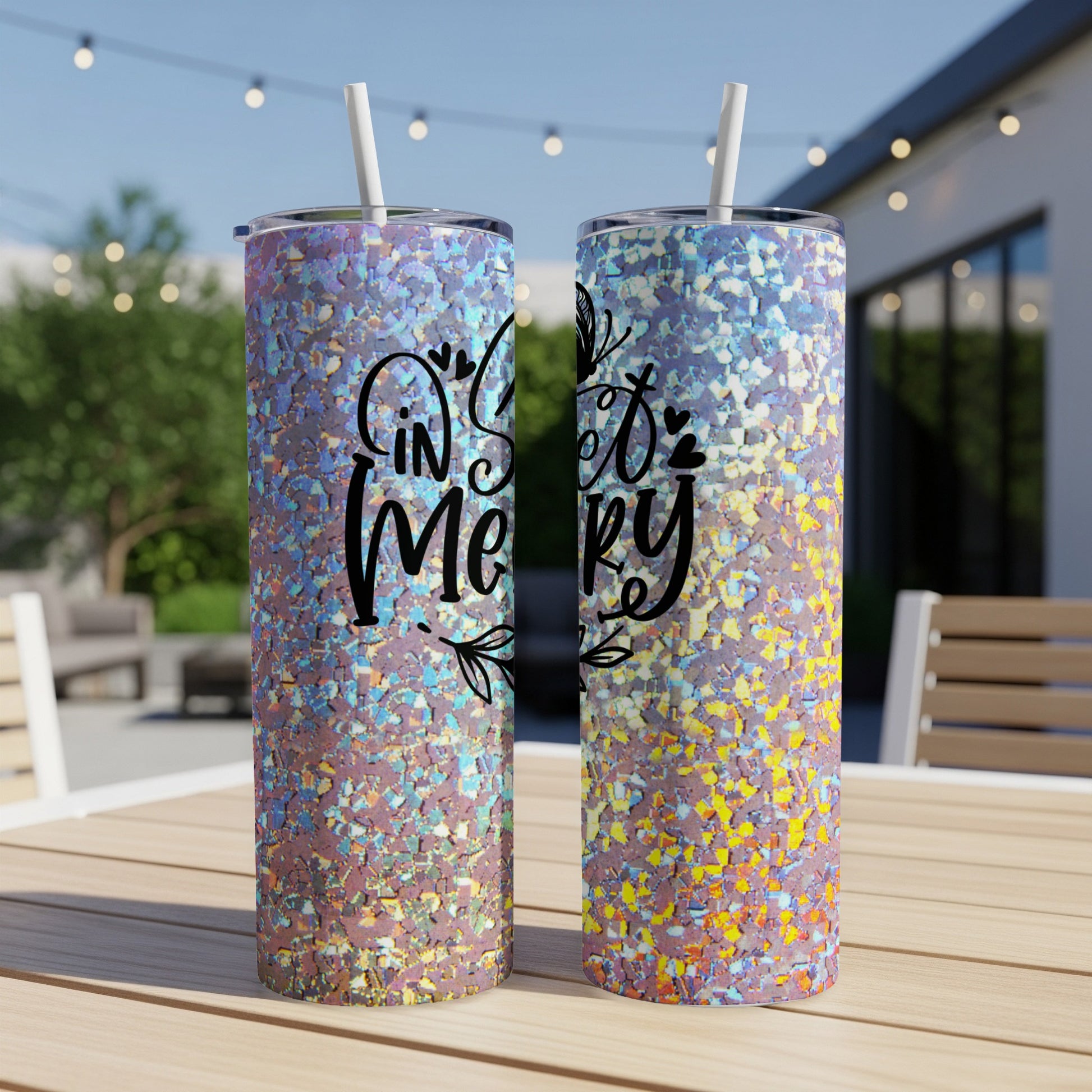 Two glittery tumblers with "In Sweet Merry" text on a wooden table.
