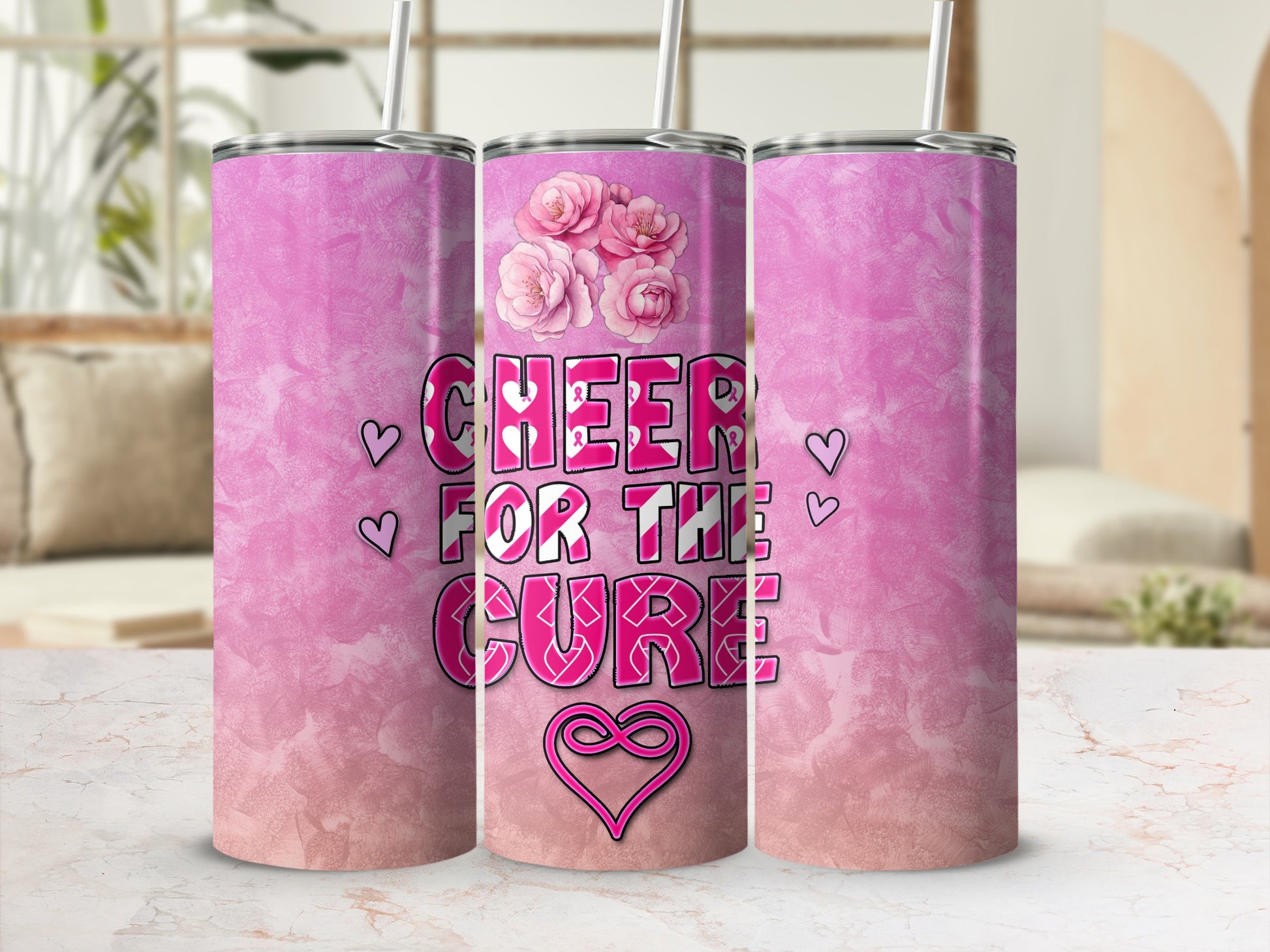 Pink tumbler with "Cheer for the Cure" and floral designs.