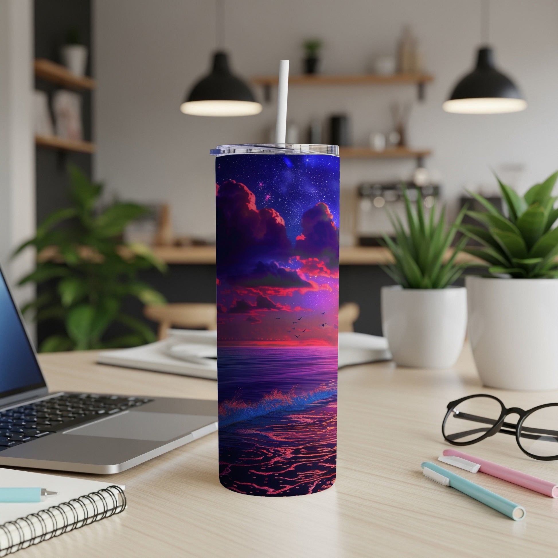 Tumbler with a vibrant starry sky over a glowing ocean and shoreline.