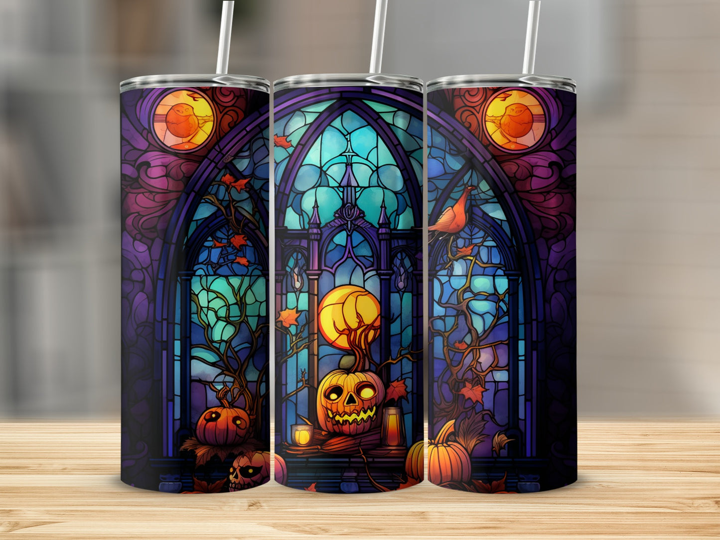 Stained glass Halloween tumblers with pumpkins and a bird against a moonlit background.