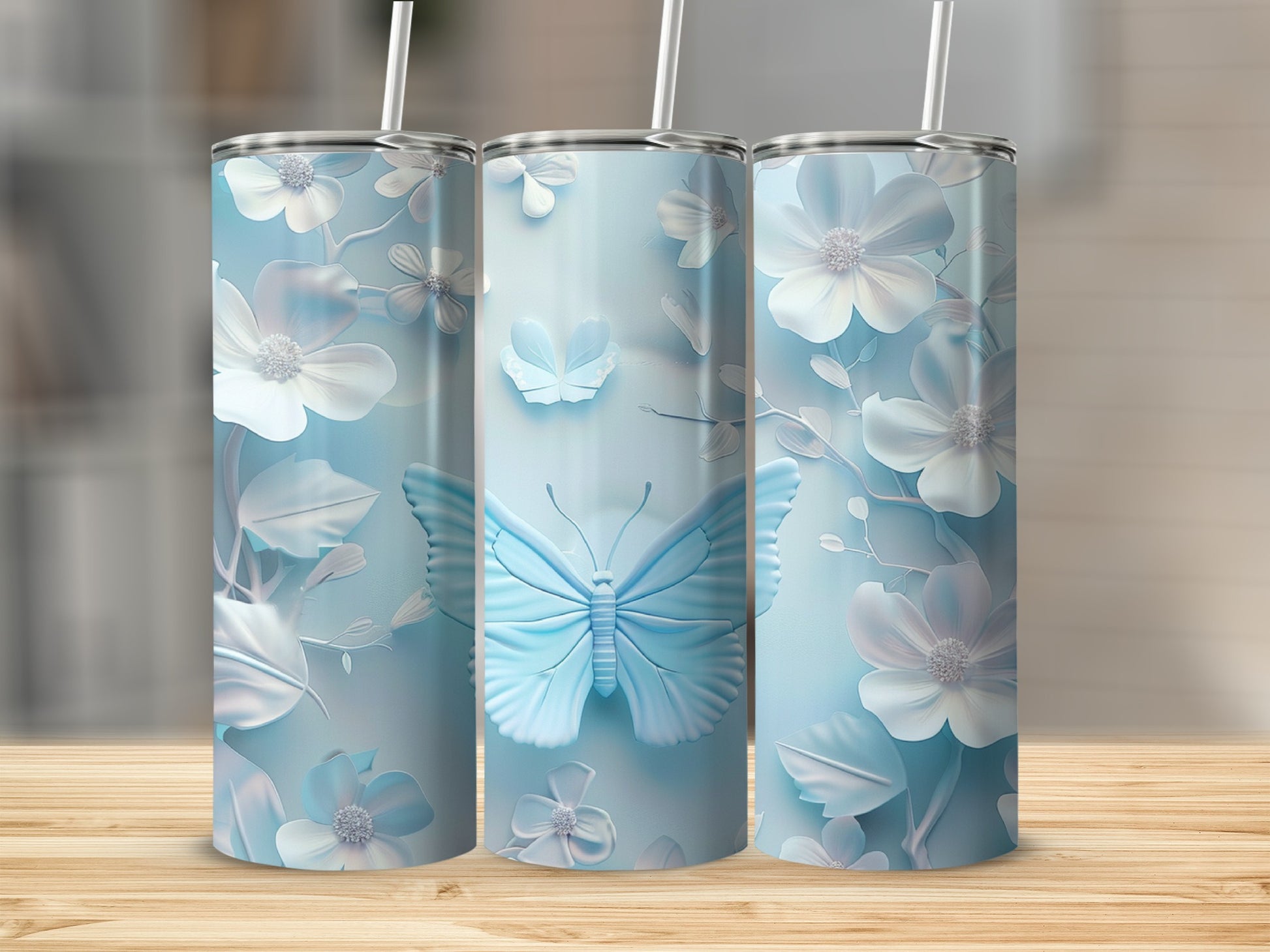 Light blue tumbler with raised butterfly and floral design.