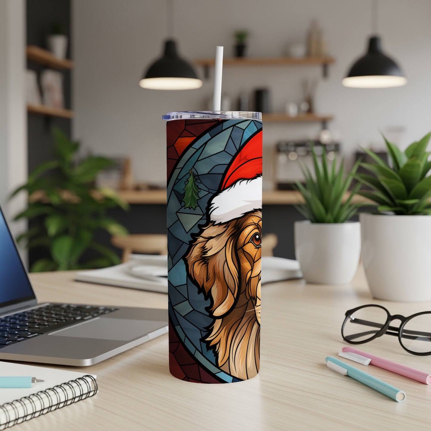 Golden retriever wearing Santa hat on stained glass tumbler.