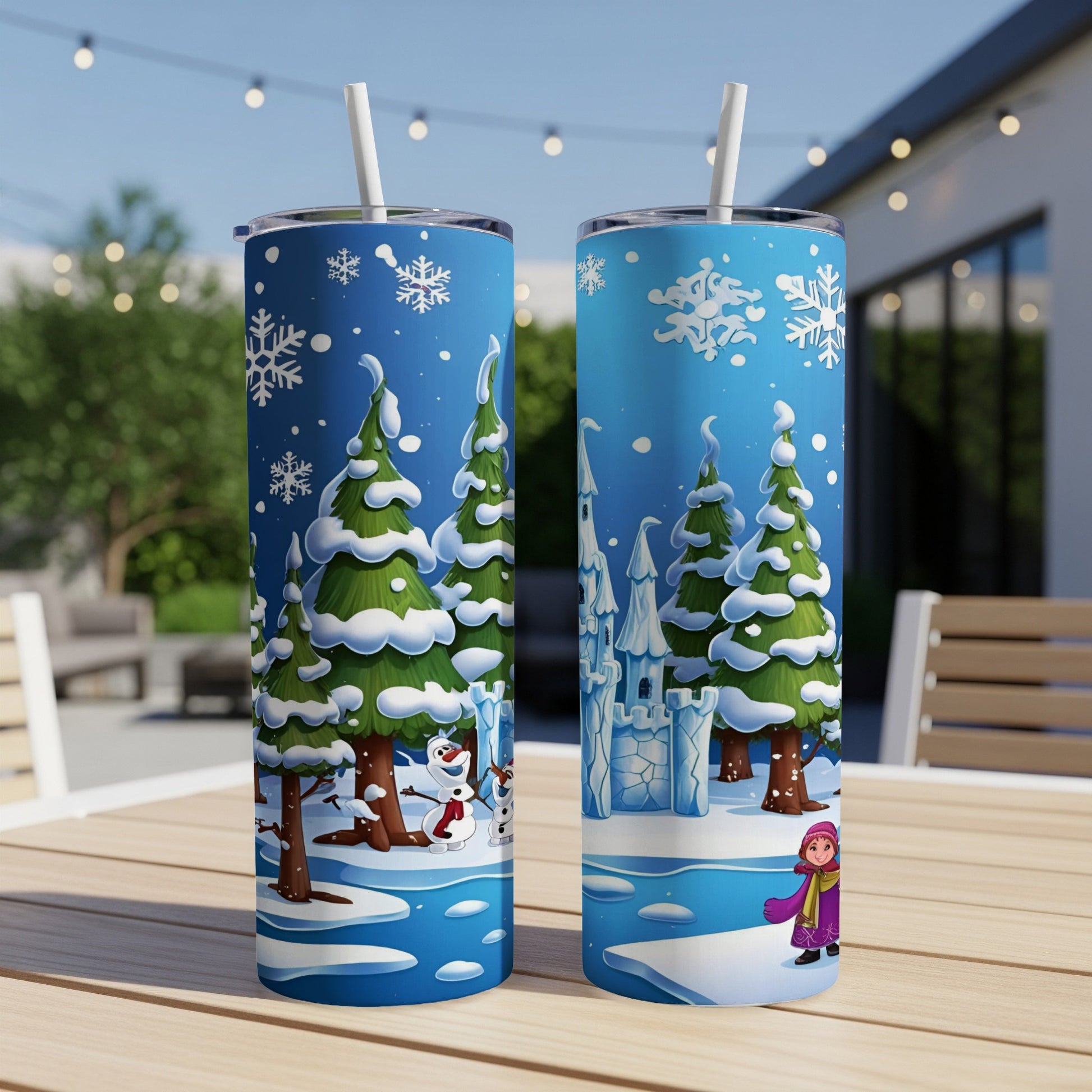 Two tumblers with a winter castle and snowman scene, suitable for cold drinks.