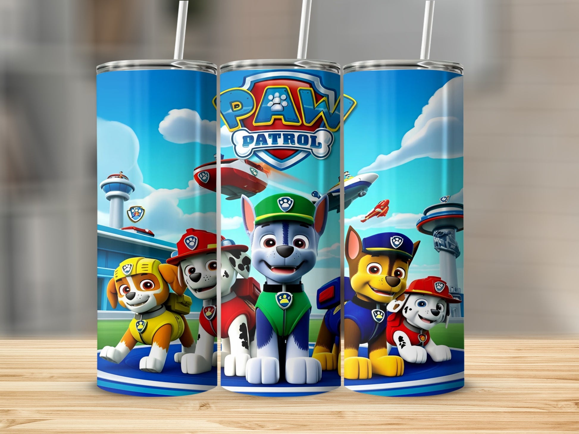 Paw Patrol characters on a blue tumbler with white straws.