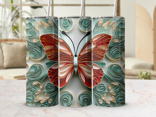 Three tumblers with a colorful butterfly design on a marbled surface.