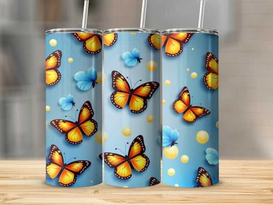 Three tumblers with orange butterflies and blue butterflies on a blue background.
