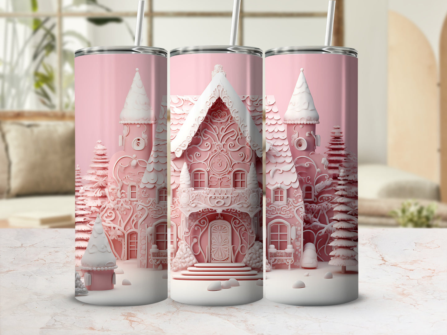 Three pink tumblers with embossed gingerbread house designs and snow.