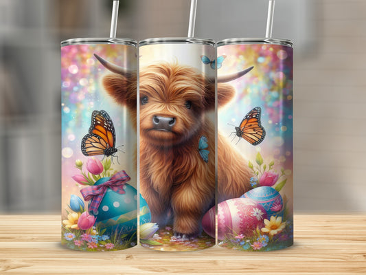 Highland cow with butterflies and Easter eggs on a festive background.