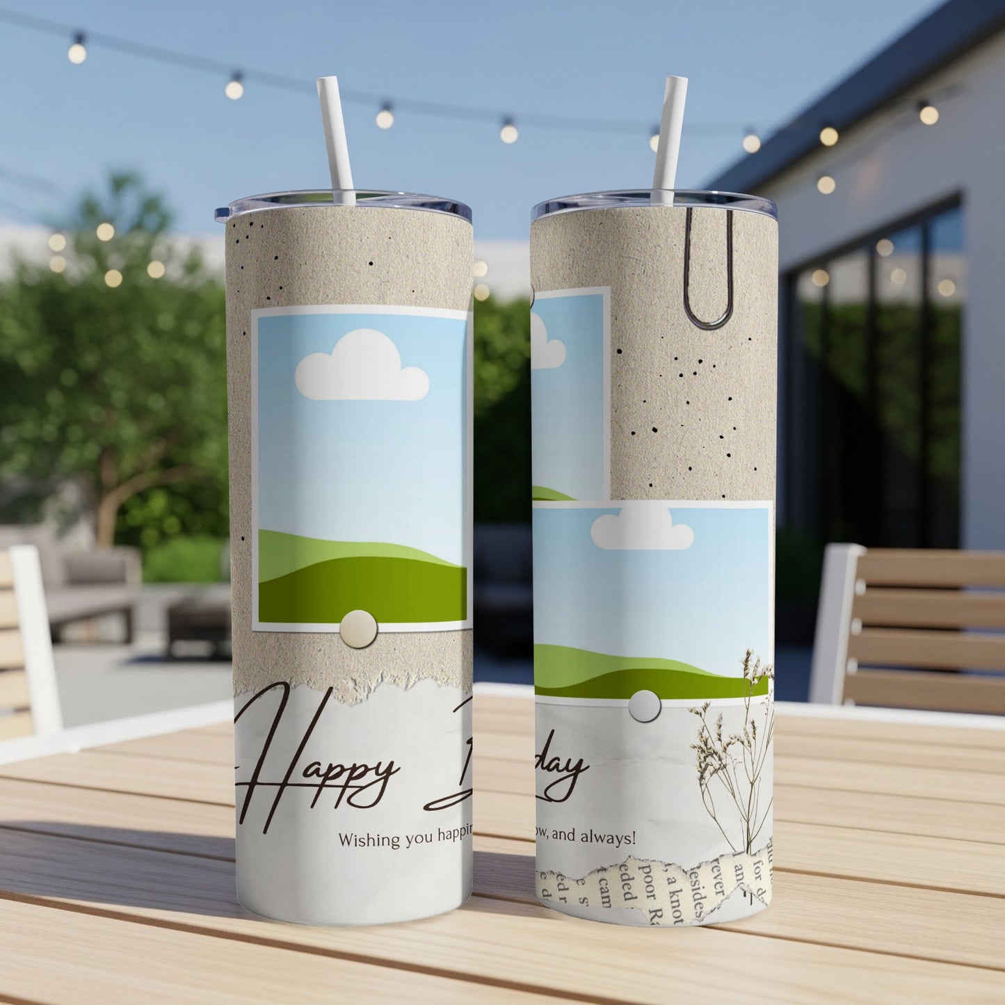 Two tumblers with "Happy Birthday" text and torn paper, clouds, and grassy hills design.