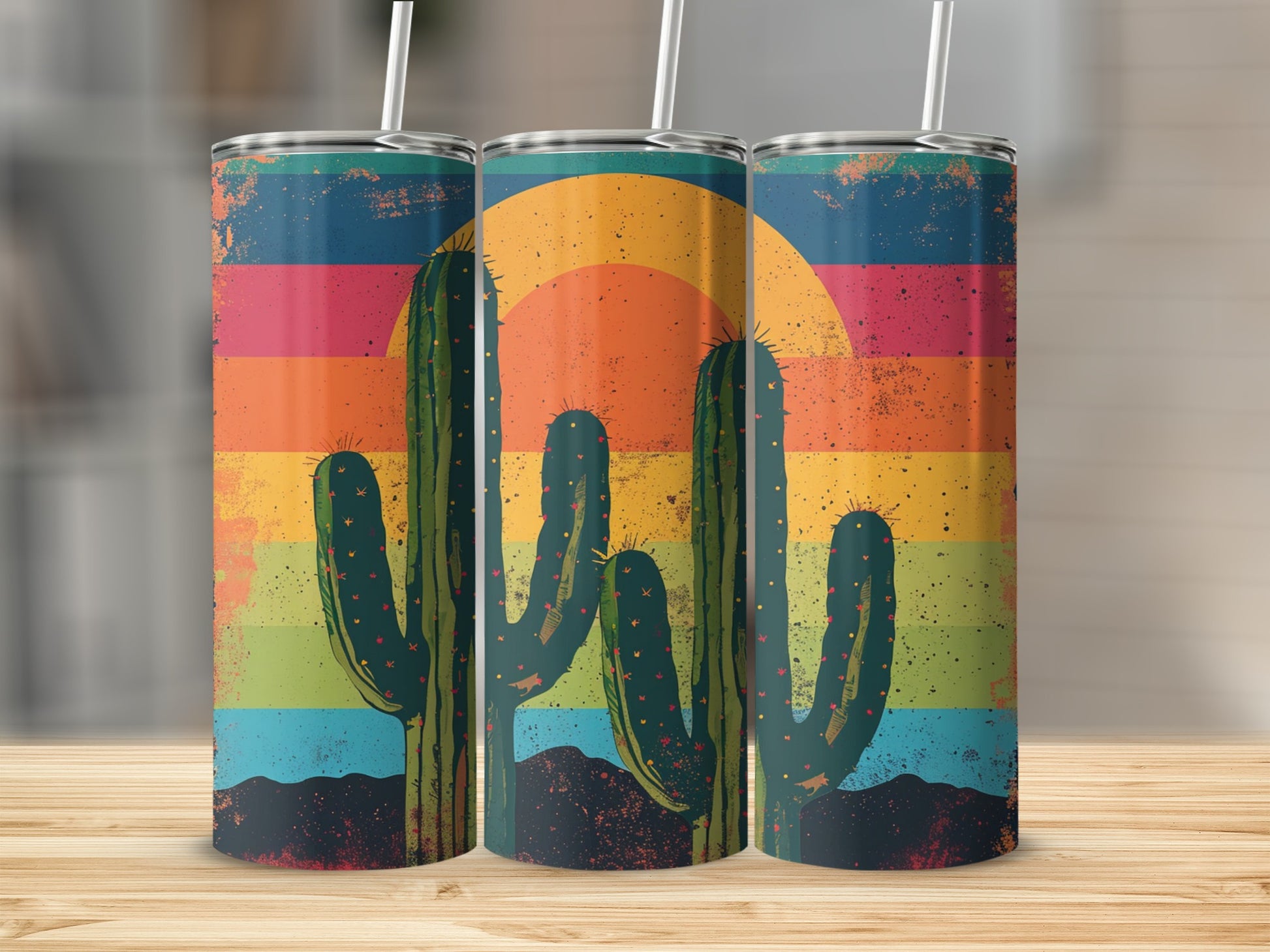 Three tumblers with a desert sunset and saguaro cactus design.