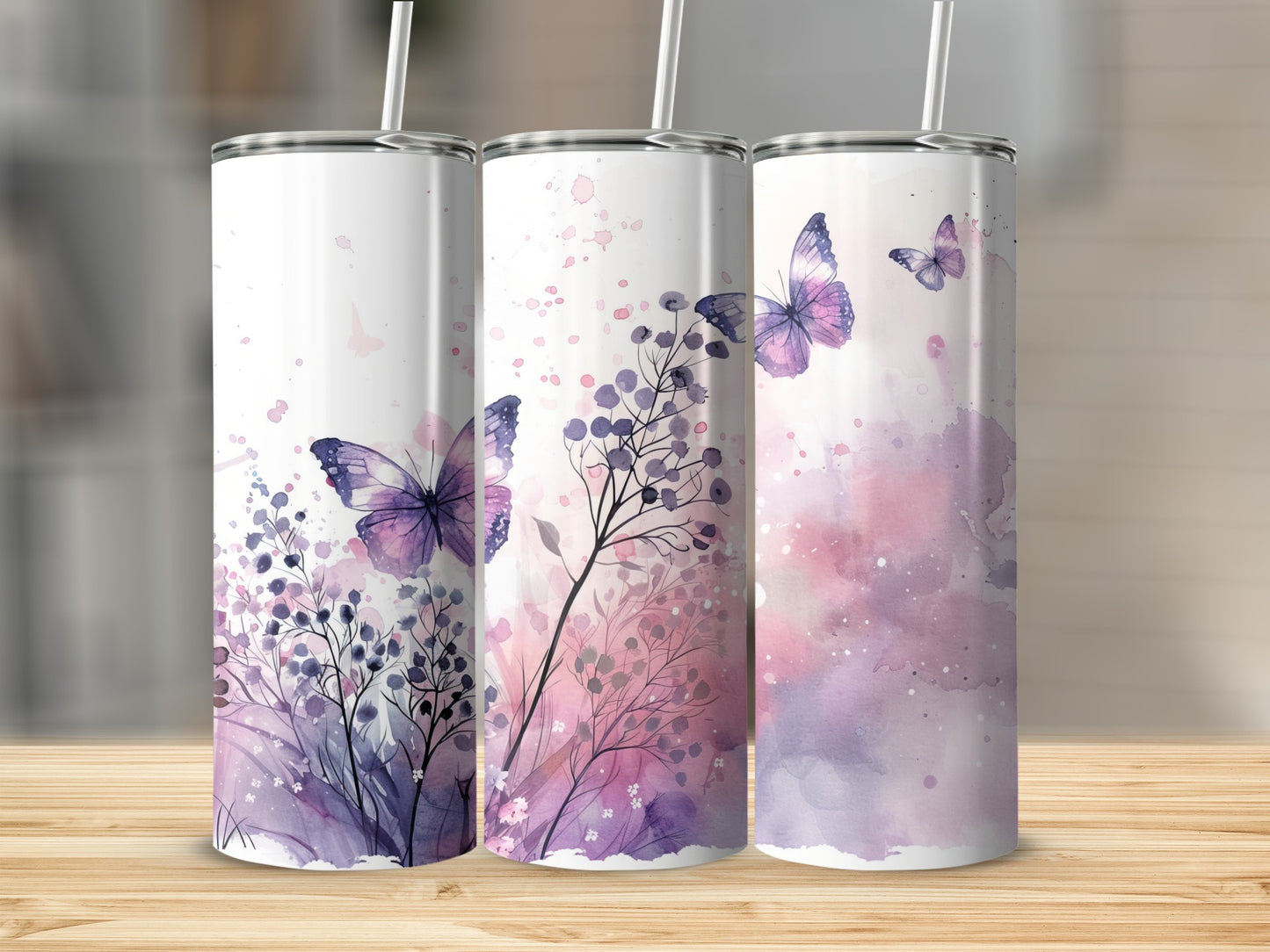 Three tumblers with purple watercolor butterflies and floral accents.