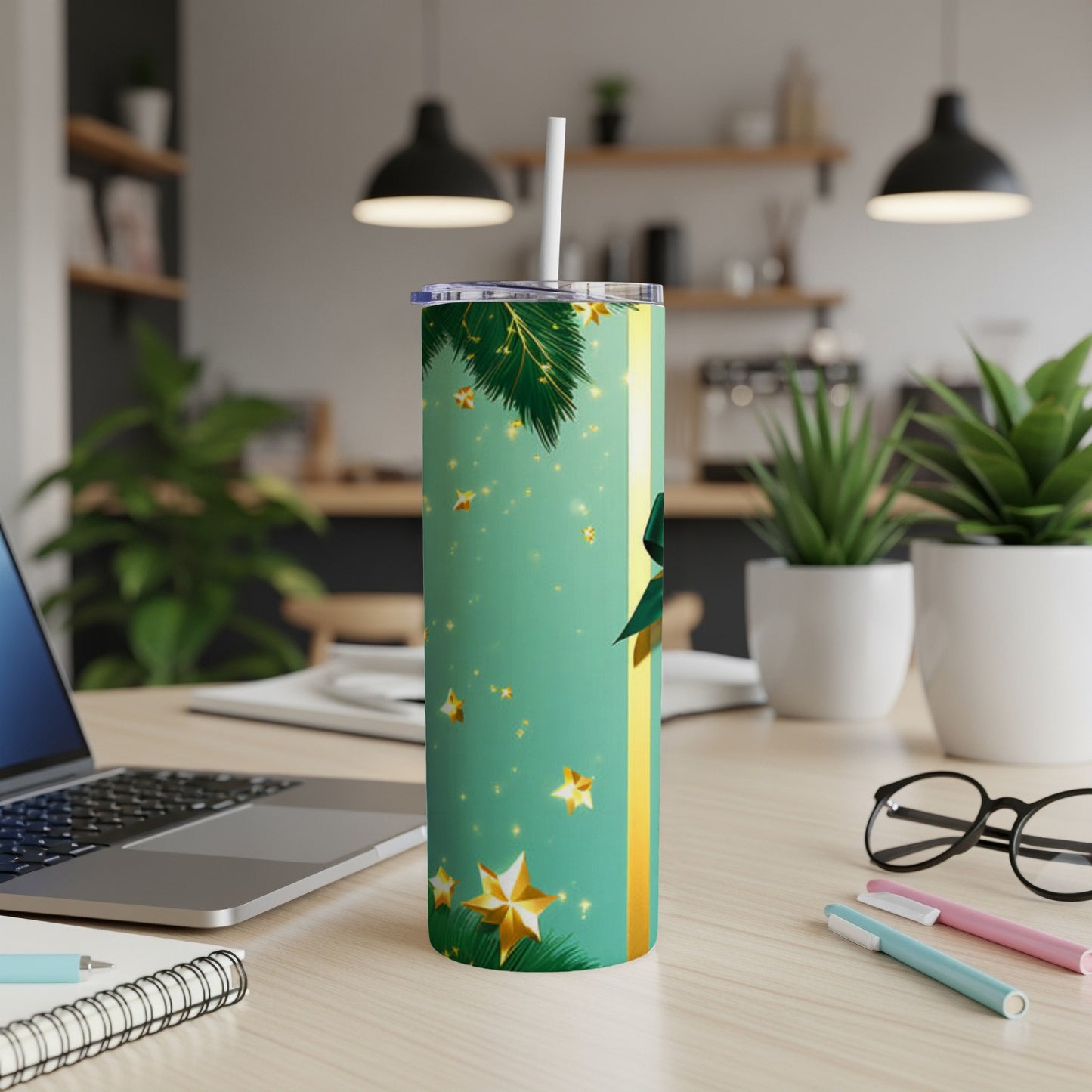 Green tumbler with gold stars, Christmas branches, and a gold stripe.