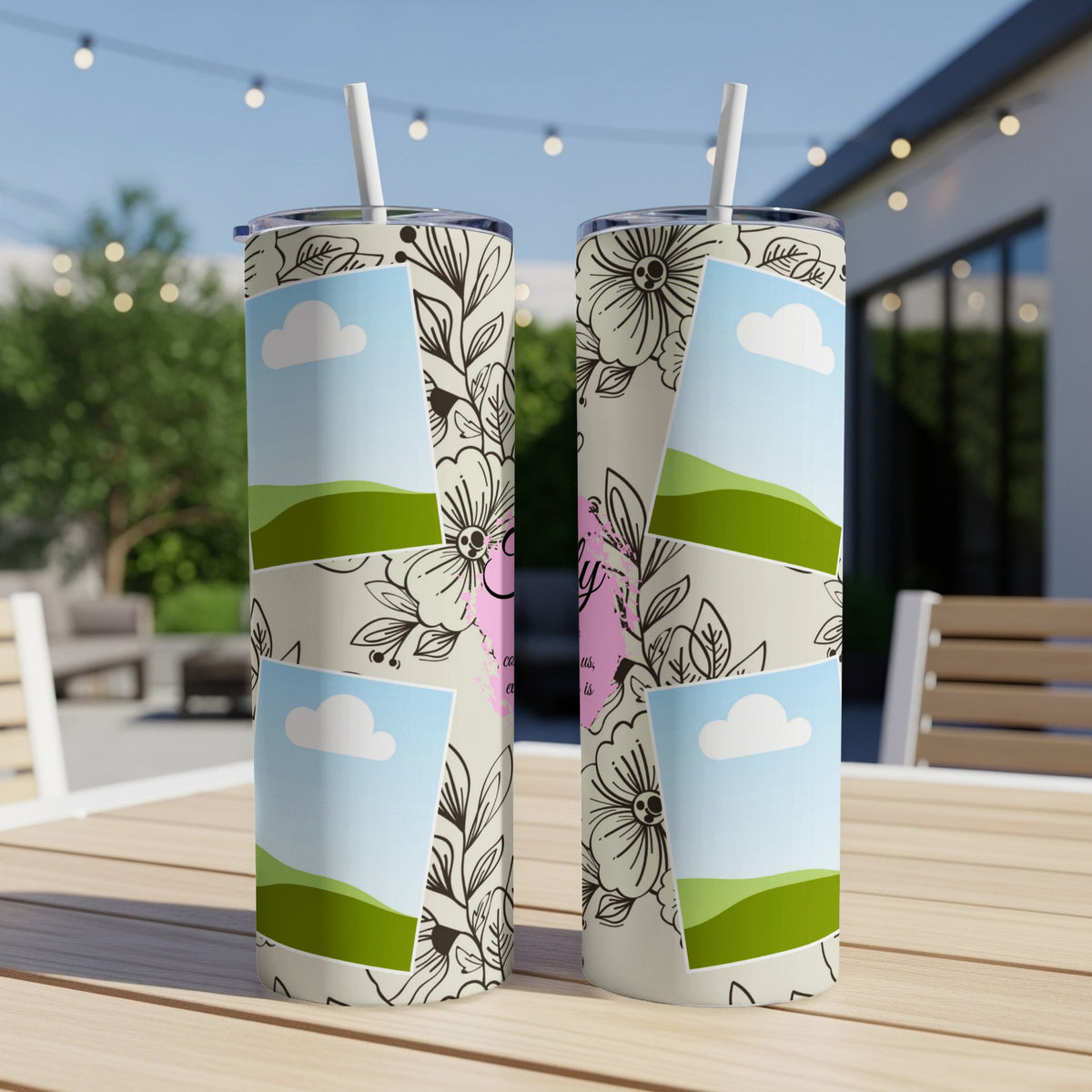 Two tall tumblers with floral pattern and photo collage featuring landscapes and clouds.