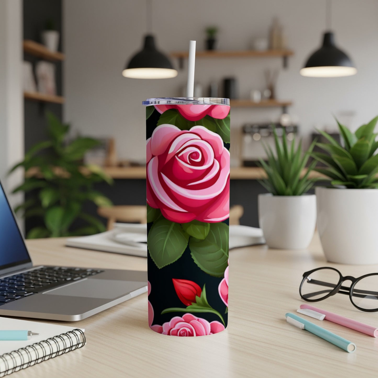 Tumbler with a dark background featuring a repeating pattern of pink roses and green leaves.