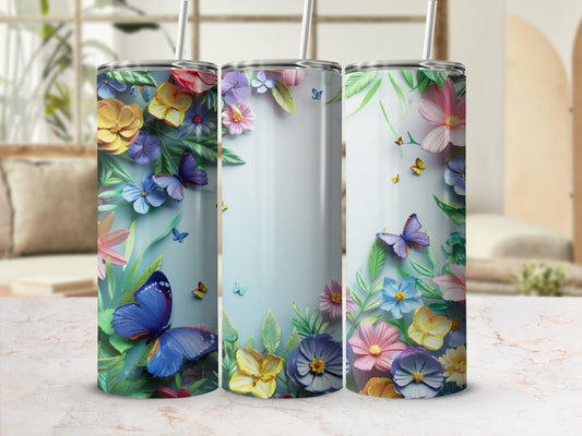 Three floral tumblers with butterflies and green leaves, presented on a marble surface.