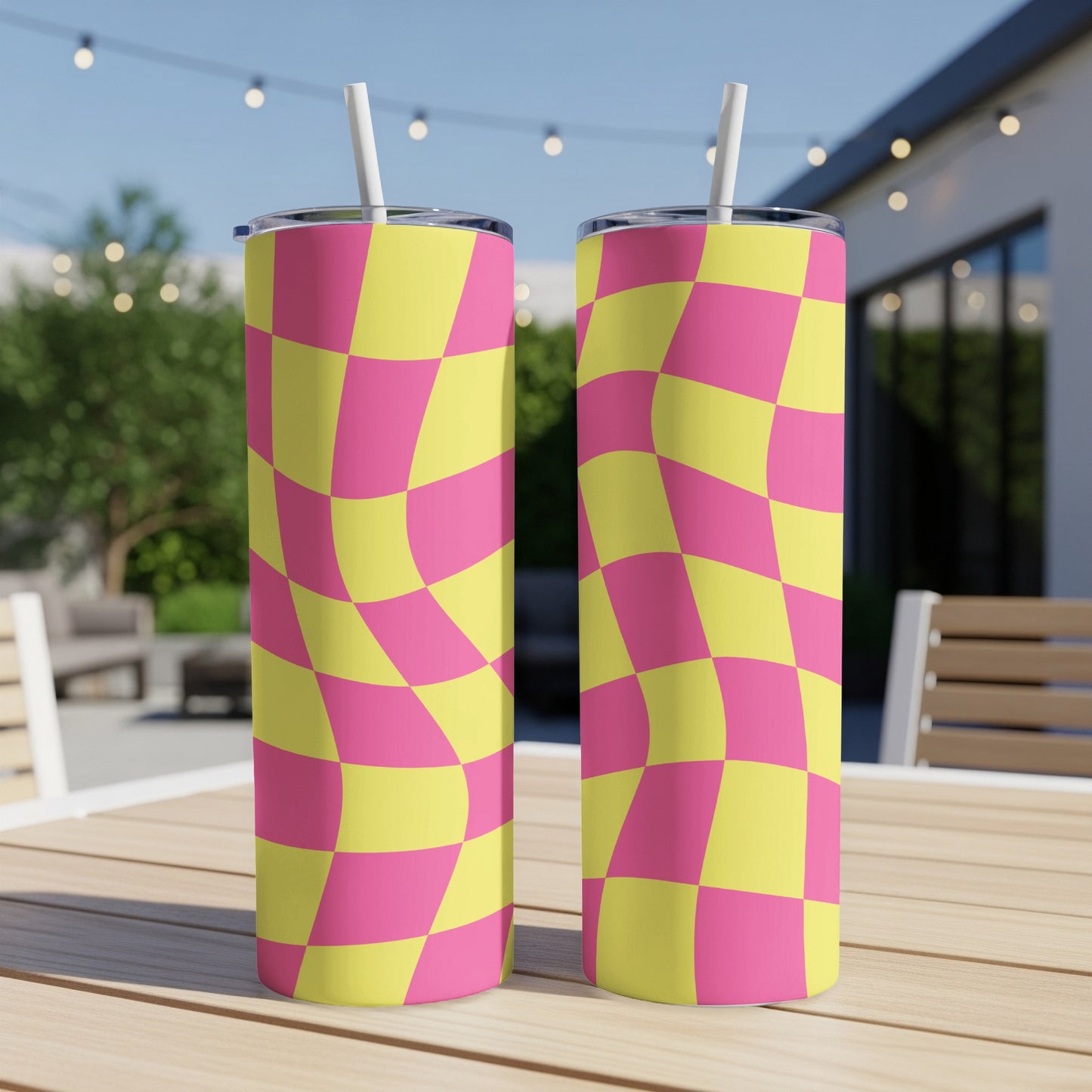 Two tall tumblers with a pink and yellow wavy checkered pattern.