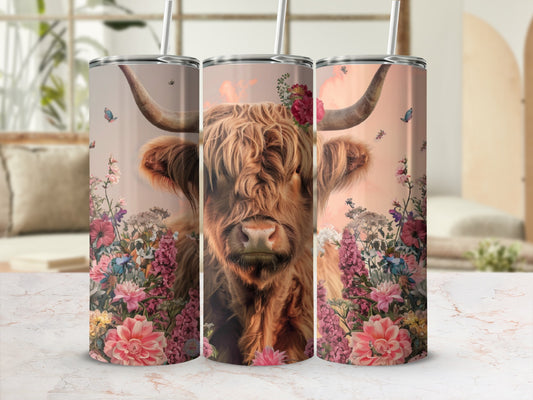 Highland cow with floral accents on a tumbler.