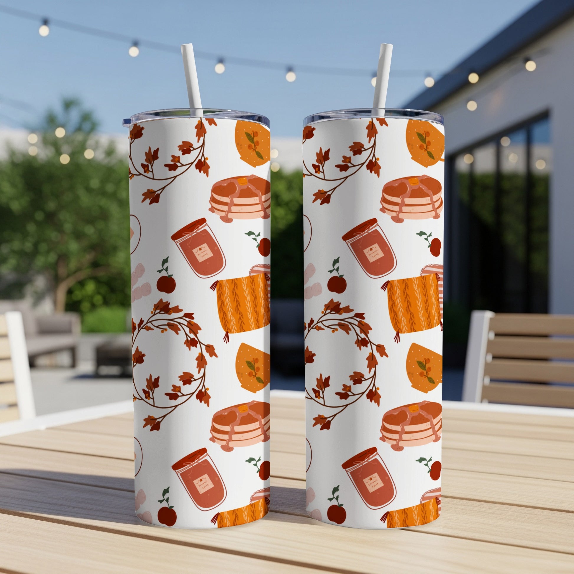 Two tumblers with fall harvest pattern: pancakes, jam, and leaves.