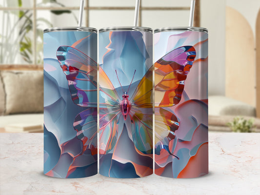 Three tumblers with a colorful iridescent butterfly design displayed on a marble surface.