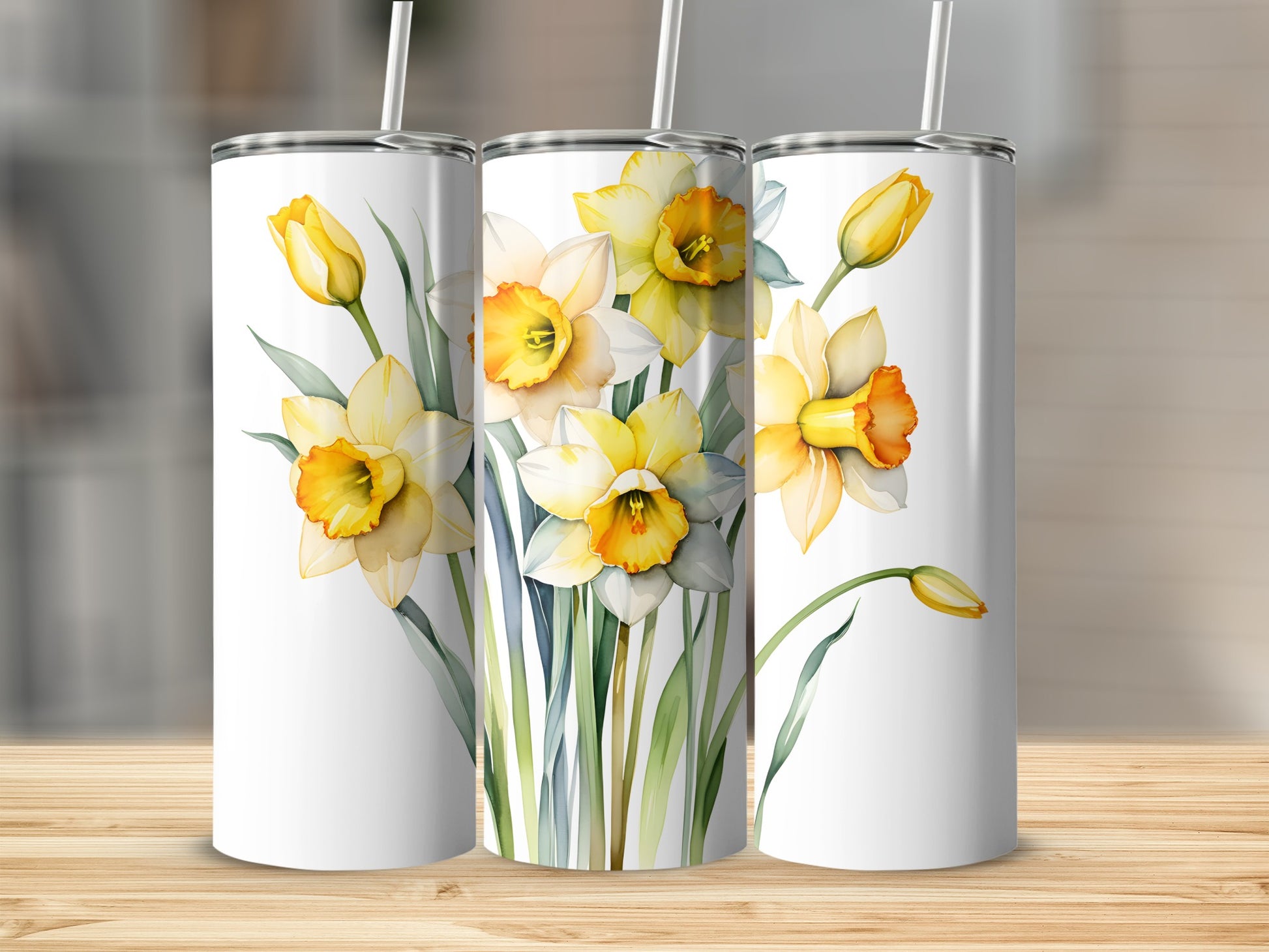White tumblers with watercolor daffodils and green stems.