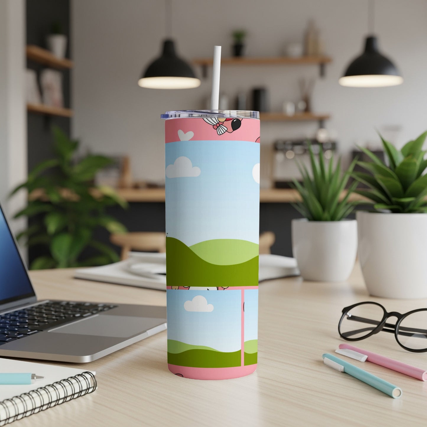 Pink tumbler with cartoon farm animals and a landscape design.