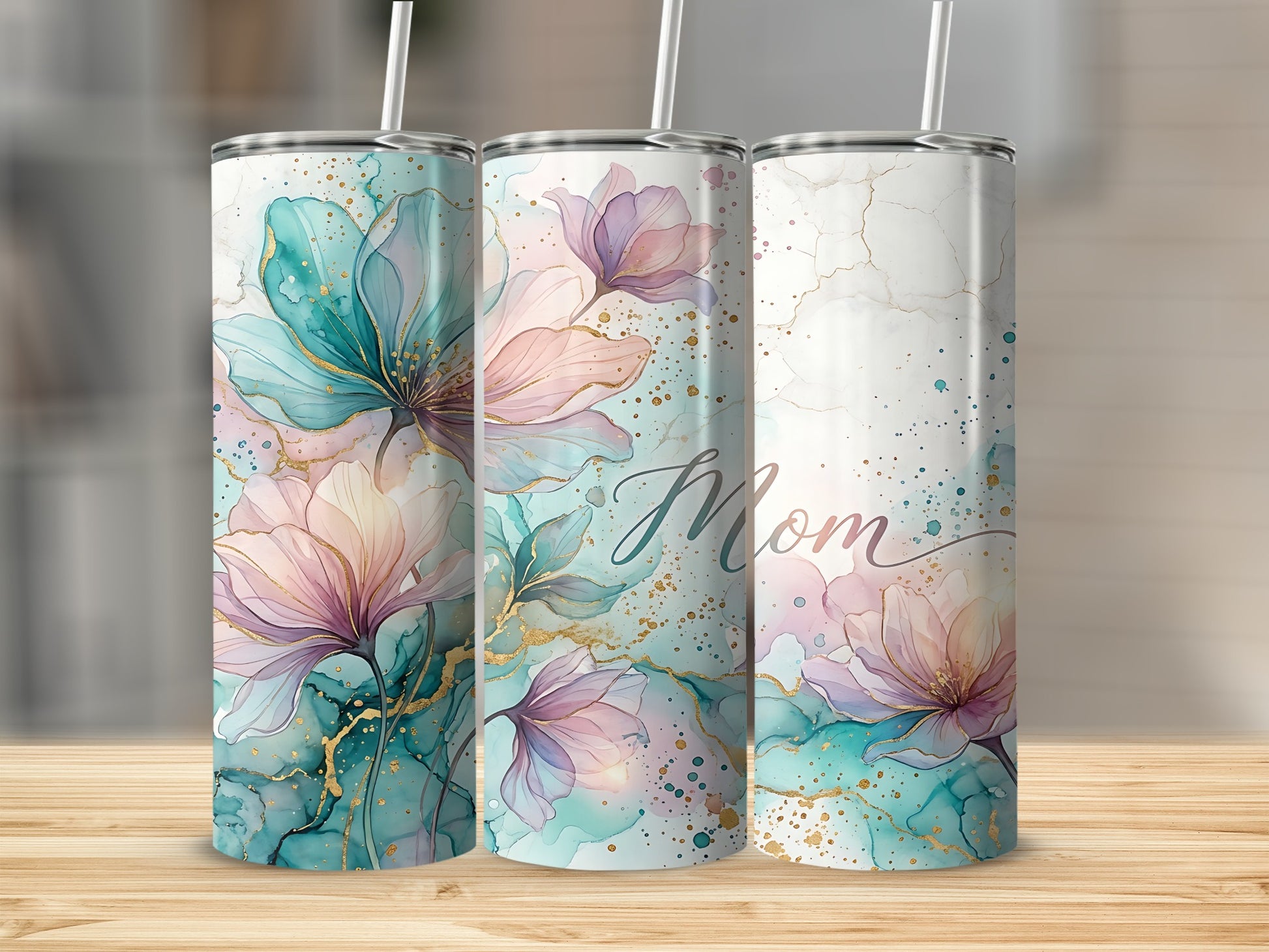Three tall tumblers with watercolor floral designs and "Mom" text.