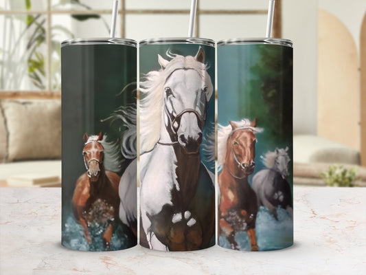 Three horses running in water, white horse in foreground.